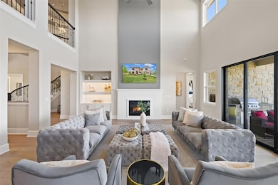 Living room with built in features, wood finished