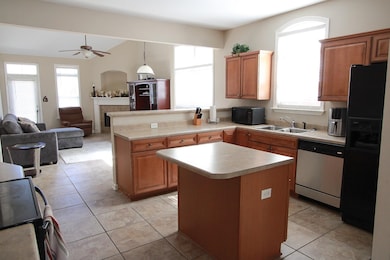 Kitchen featuring a center island, a peninsula, li
