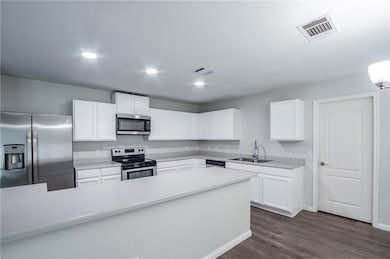 Kitchen featuring appliances with stainless steel