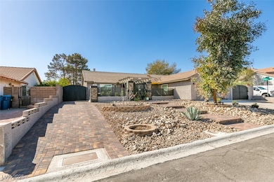 Ranch-style house with stucco siding, fence, and a