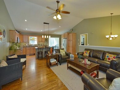 Great Room open to Kitchen with adjacent Sunroom/D
