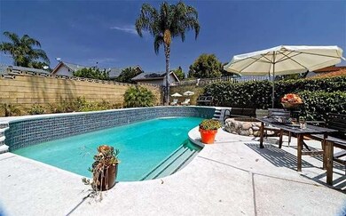 Oblong, multi-level, Saltwater pool featuring a fi