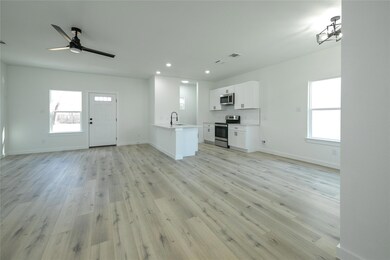 Unfurnished living room with ceiling fan, a health