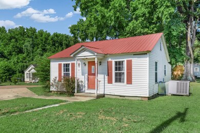 View of front facade featuring cooling unit and a 