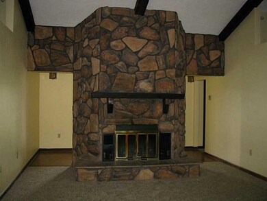 Living Room. Stone wood burning fireplace.