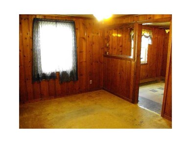 Living Room. Knotty Pine flows from the Living Roo