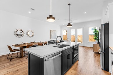 The stunning accent island and expansive quartz countertop is the centerpiece of the first floor and primed for family and guests.