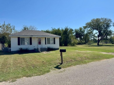 View of front of property with a front yard and a porch