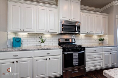 Gorgeous kitchen cabinetry with accenting subway t