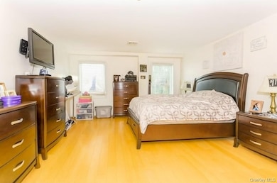 Bedroom with light wood-type flooring