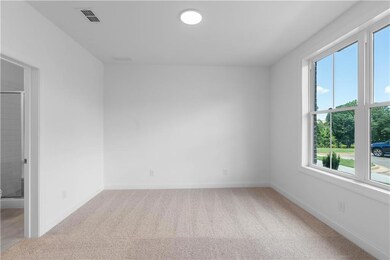 bedroom on terrace level off of garage - *pictures represent a previously built home * photos are for representation only