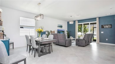 Dining area featuring baseboards and light tile patterned floors