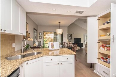 Kitchen looking out to dining, living area. Pantry
