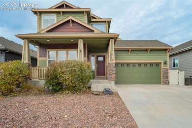 Front Exterior (Alternate View) – A closer look at the welcoming entry and porch area, showcasing the home’s attractive trim details and warm color palette.