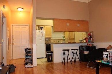 Kitchen with freestanding refrigerator, a wainsco