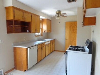 Kitchen with stove and built in dishwasher with do