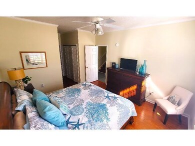 Bedroom with hardwood / wood-style flooring, ceili