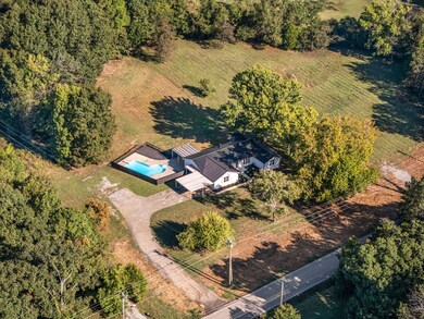 Home sits on 1.4 acres with two additional lots available to the right for purchase.