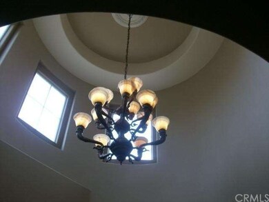 High Ceiling Entry Way with Beautiful Hanging Chan
