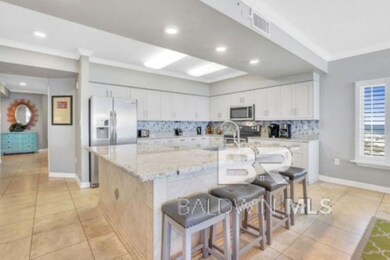 Kitchen with tasteful backsplash, crown molding, a kitchen breakfast bar, white cabinetry, and recessed lighting