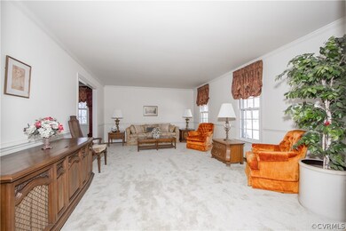 Living Room with hardwood floor, crown molding