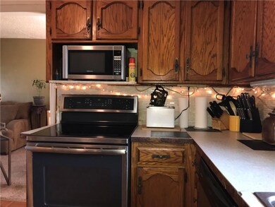 Smooth glass top range oven and microwave to remain with the home