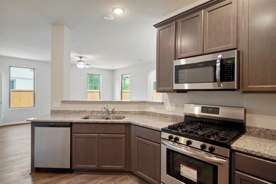 Stainless steel appliances, and breakfast bar for extra seating!