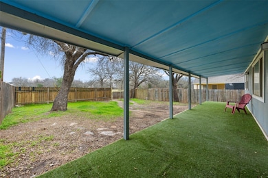 View of fenced backyard