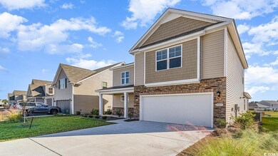 View of front of home featuring a garage and a fro