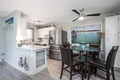 Kitchen featuring sink, kitchen peninsula, white c