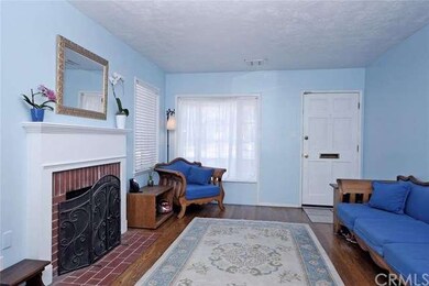 Enter into the living room, with cosy wood burning