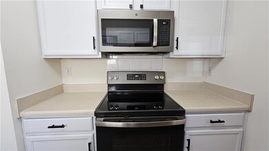 Kitchen featuring electric range, stainless steel 