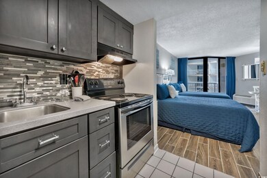 Kitchen with sink, a wall mounted AC, stainless st
