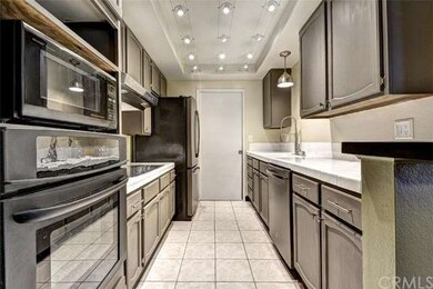 This beautiful modern kitchen includes a large wal