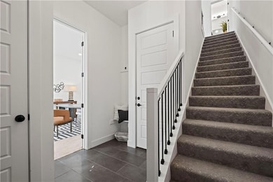 Stairway featuring tile patterned flooring