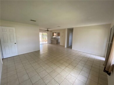 Living room, dining area, and breakfast bar viewed