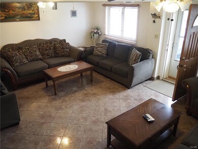 Front living room with tile floor.