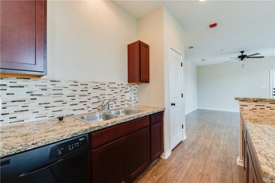 Kitchen featuring sink, light wood-type flooring,