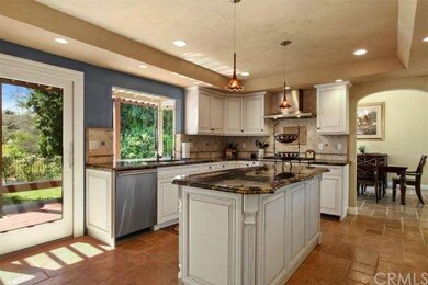 The kitchen is beautiful overlooking the lush rear