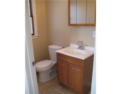 Bathroom. The half bath in unit 1 is located off t