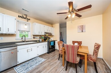 Kitchen with view of back door and laundry room