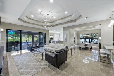 Living room featuring a notable chandelier and a r