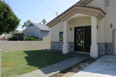 Dual French Doors with timed sprinklers for the la
