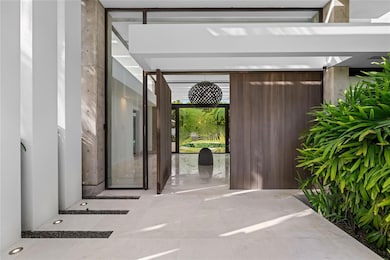 This beautiful estate sits on a 2,219-square-meter lot and offers 9,313 square feet of living space, all on a single level.