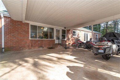 2 Car Carport is open to the deck and there is a door to the Den...very convenient!
