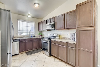 Kitchen featuring appliances with stainless steel