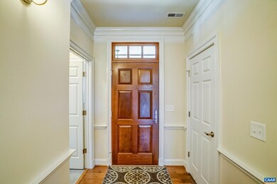 Solid wood front door with transom.