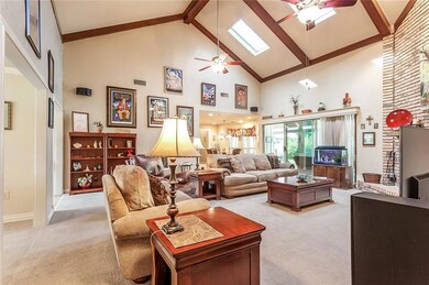 Den opens onto huge sunroom.