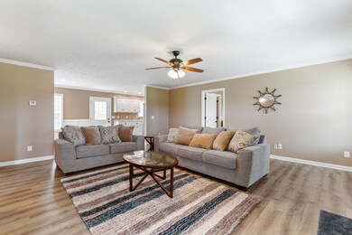 In the living room, you will find laminate flooring and crown molding! 408 Crouch Rd  Manchester, TN 37355