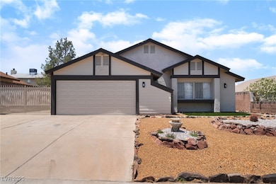View of front of home with concrete driveway, stuc